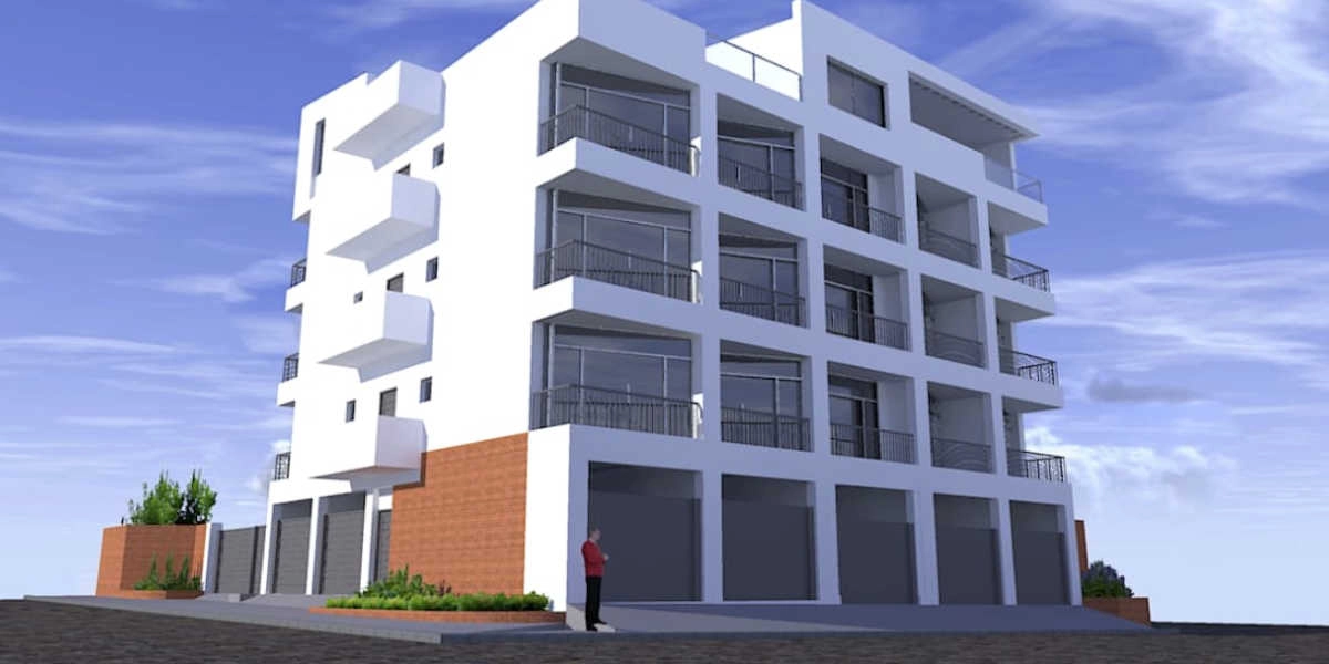 Edificio moderno de cuatro pisos con balcones de vidrio, portones de garaje y detalles de ladrillo bajo un cielo parcialmente nublado